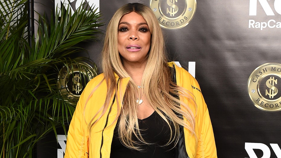Wendy Williams sports yellow coat with black tank top