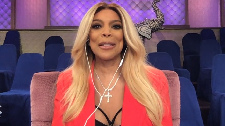 Wendy Williams chats via Zoom wearing red blazer and strappy black top.