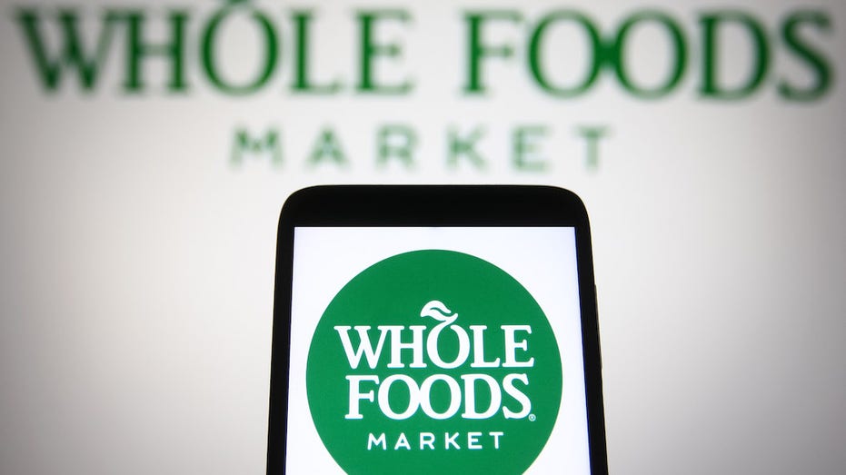 Photo of Whole Foods logo on smartphone