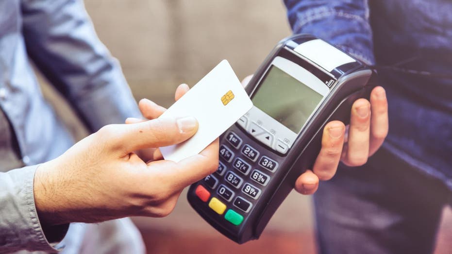 Customer pays for service or item with a handheld credit card processor