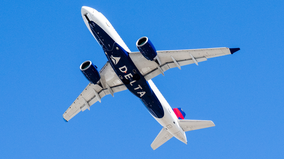 Delta airplane in sky