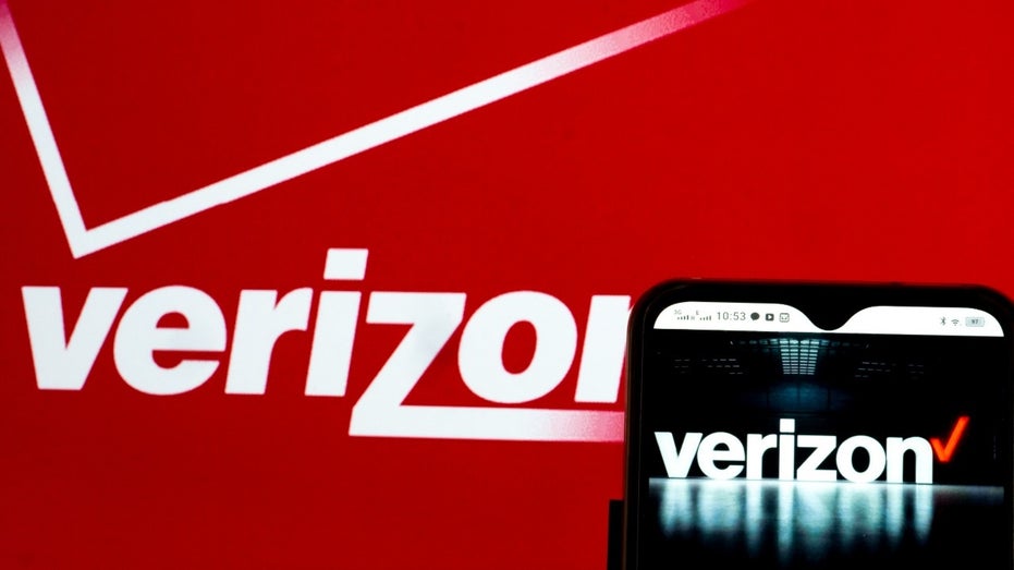 Verizon photo illustration showing the logo and a cell phone on a red background