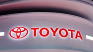 Toyota cuts output target amid chip crunch as profit tumbles 25%
