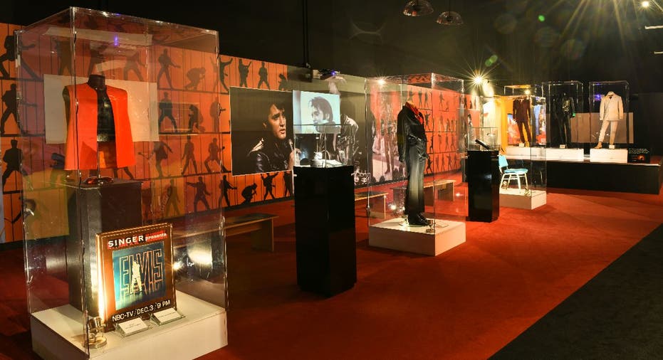 A red-themed exhibit room with Elvis Presley's clothes and more.