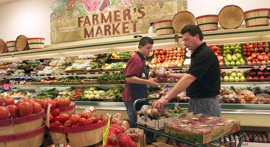 Man shops for groceries in produce section