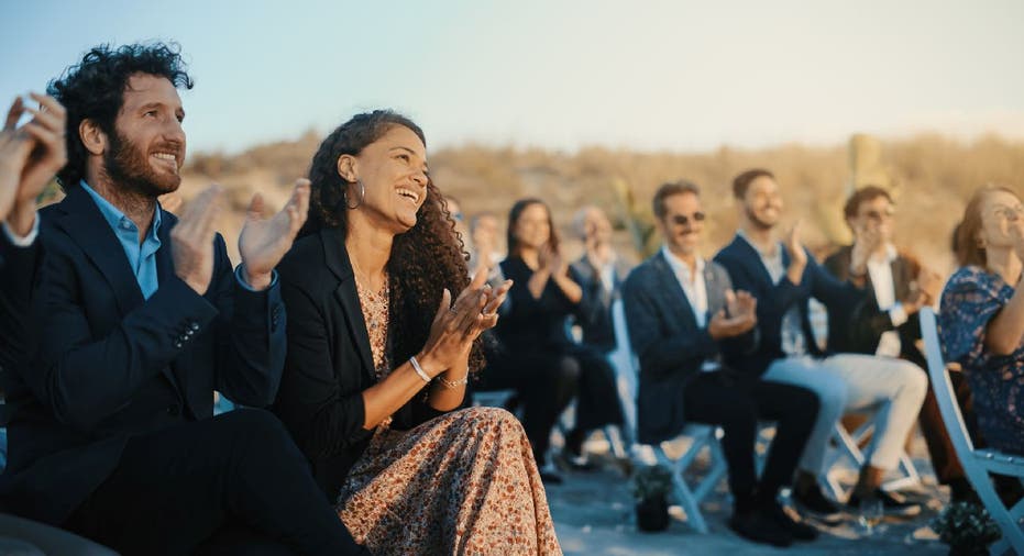 Wedding guest sit in aisle seats