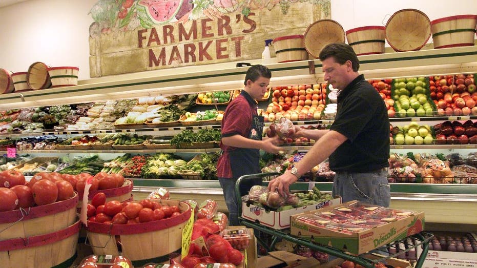 Man shops for groceries in produce section