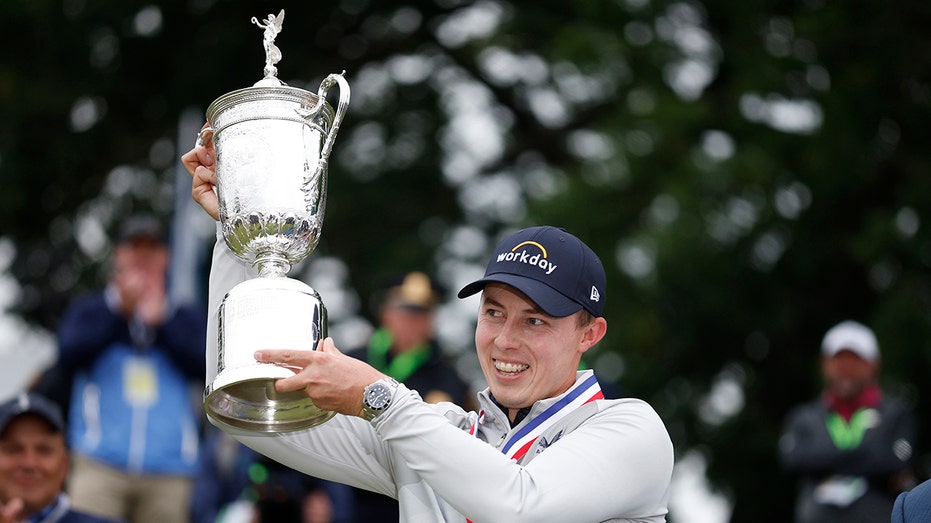 Matt Fitzpatrick raises the US Open trophy