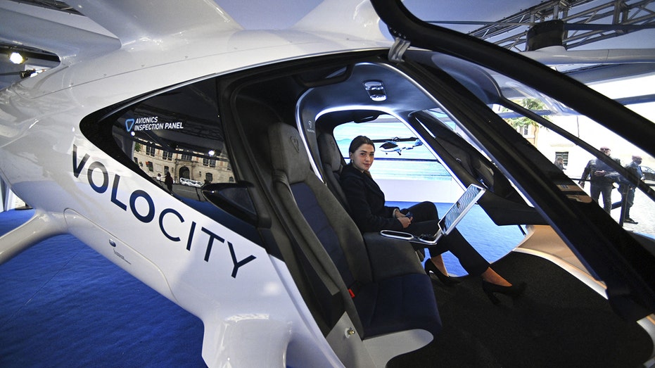 Woman sits inside VoloCity air taxi