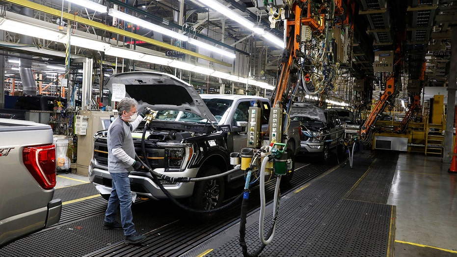 ford employee works in plant