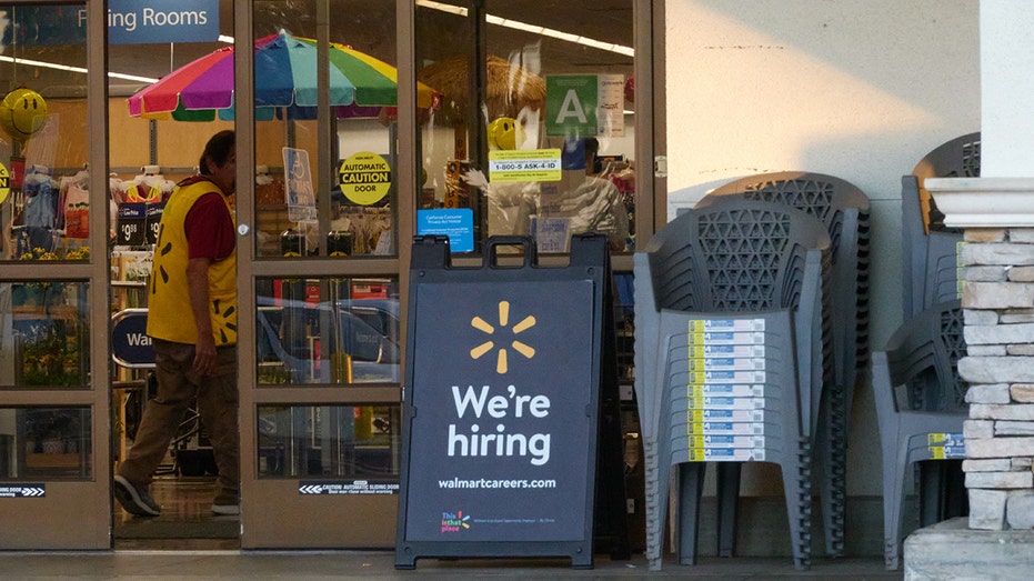 We're Hiring" sign outside a Walmart store