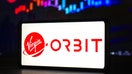 In this photo illustration, a Virgin Orbit Holdings logo