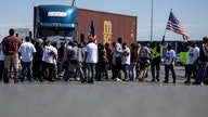California truckers pledge to continue blockade of Oakland port over controversial labor law