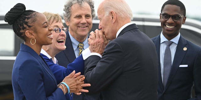 President Joe Biden is greeted by Rep. Shontel Brown, left, Rep. Marcy Kaptur, Sen.  Sherrod Brown and Cleveland Mayor Justin Bibb at Cleveland Hopkins International Airport in Cleveland on July 6, 2022.