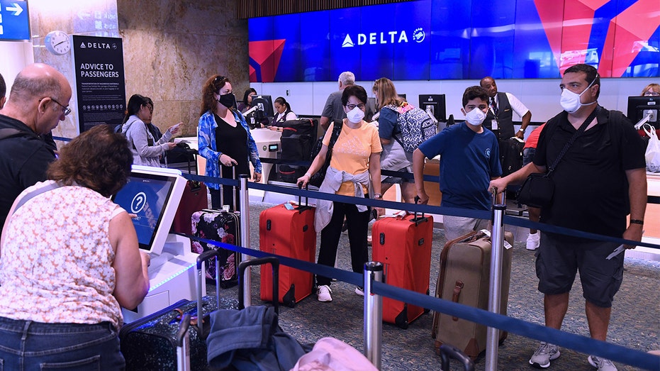 Delta Air Lines check-in line is seen in Orlando on July 1, 2022