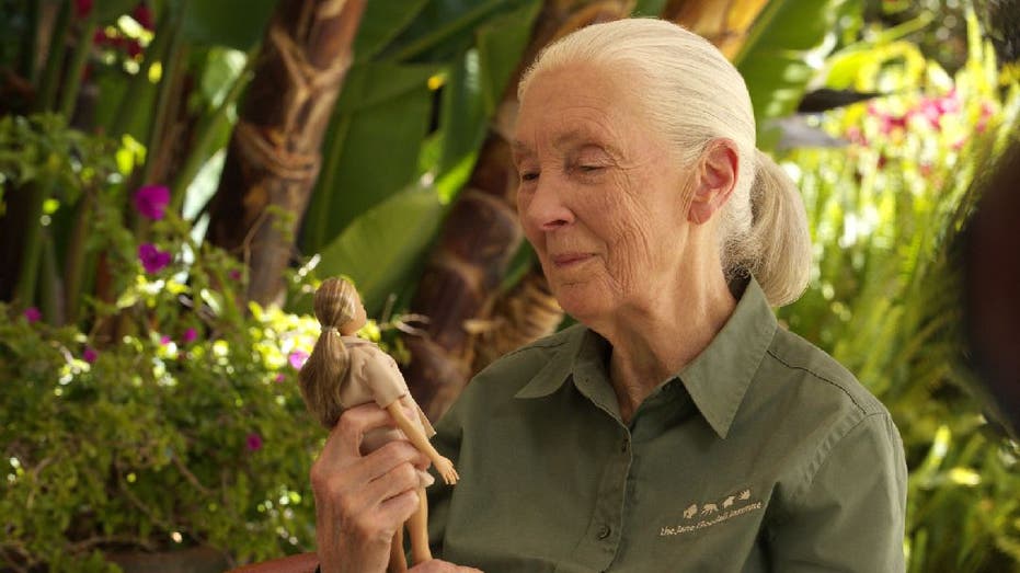 Jane Goodall holds Barbie doll