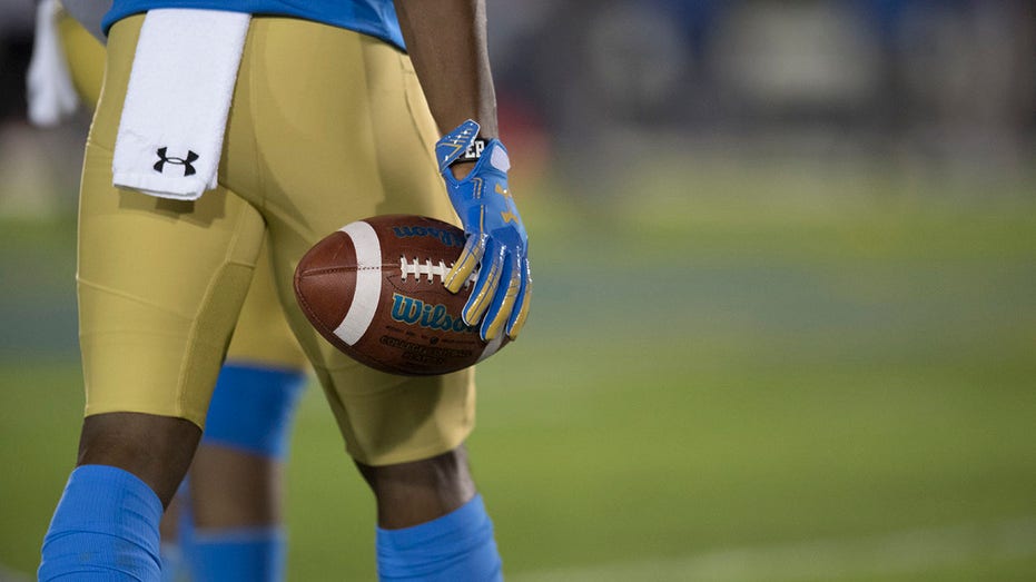 An Under Armour towel on a UCLA player