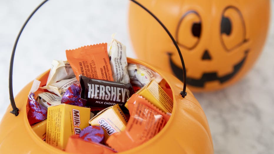 Halloween candy in trick-or-treat bucket