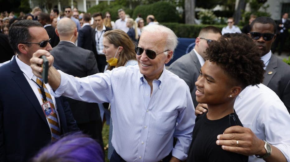 President Joe Biden poses