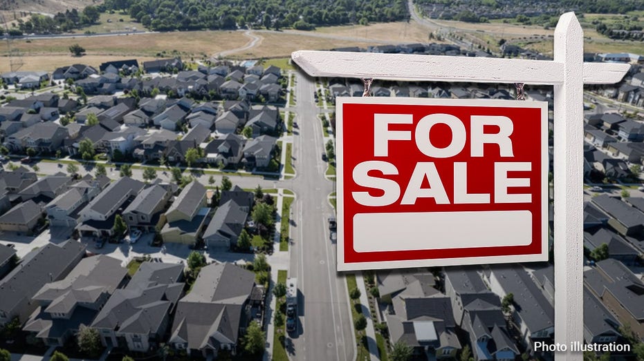 A "For Sale" sign in front of a photo of homes