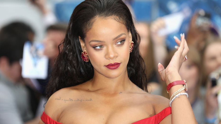 Rihanna attends a premiere