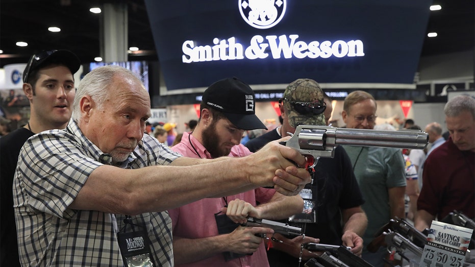 Smith & Wesson guns are displayed at the National Rifle Association meeting in 2017