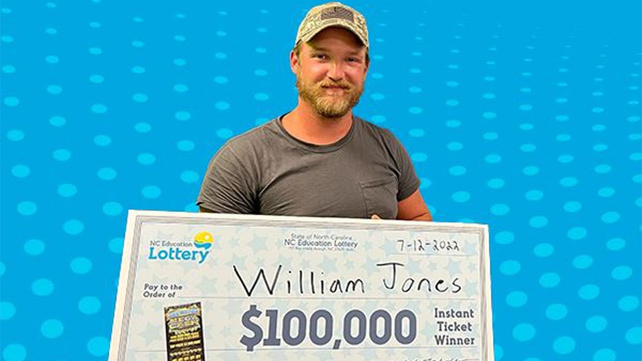 William Jones with his lottery check
