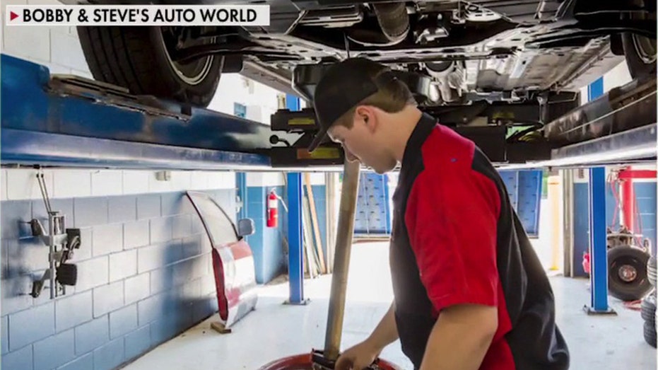 mechanic under car