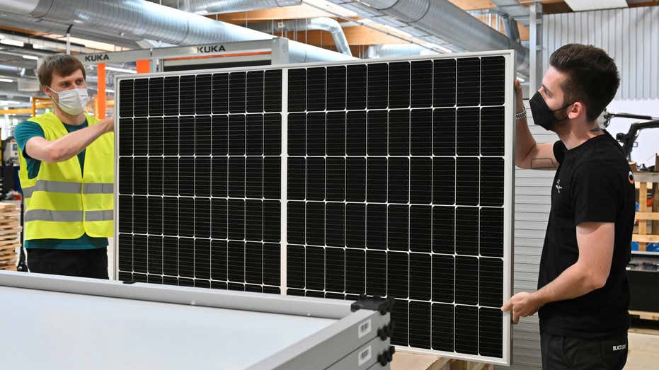 German solar technicians preparing solar panels