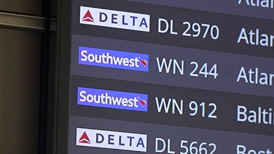 A photo of a flight board showing several Southwest and Delta flights