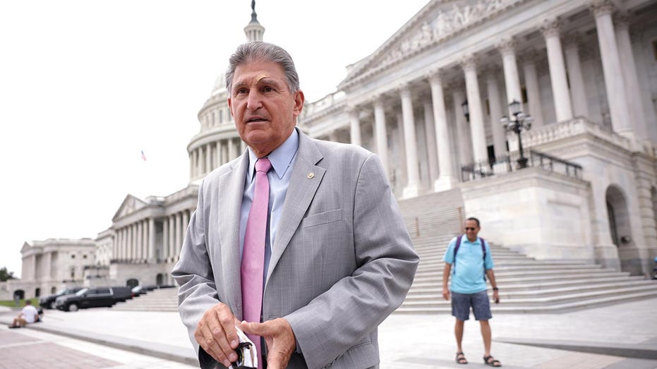 Sen. Joe Manchin in front of the Capitol building