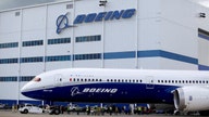 Boeing takes $2.8B hit in defense business, keeps cash flow goal