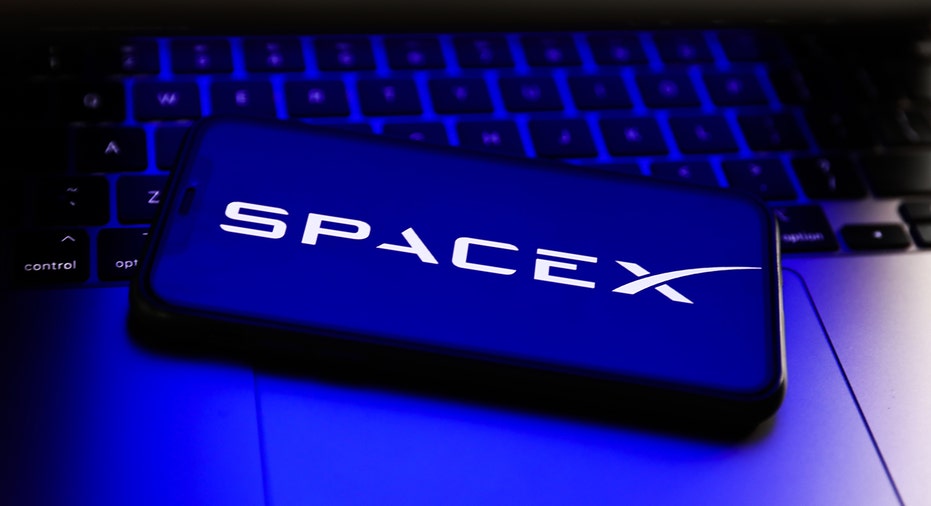 The SpaceX logo on a phone
