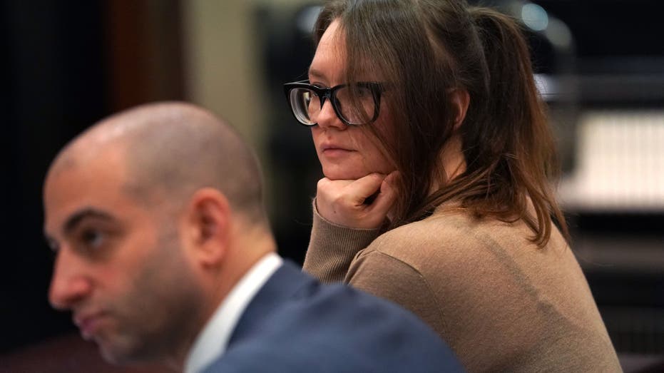 Anna Sorokin show at the defense table at her larceny trial in 2019