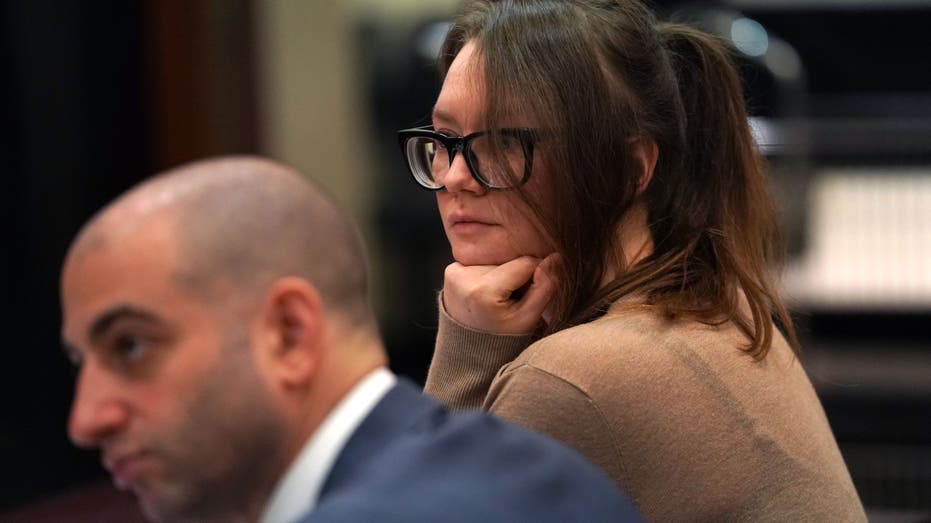 Anna Sorokin show at the defense table at her larceny trial in 2019