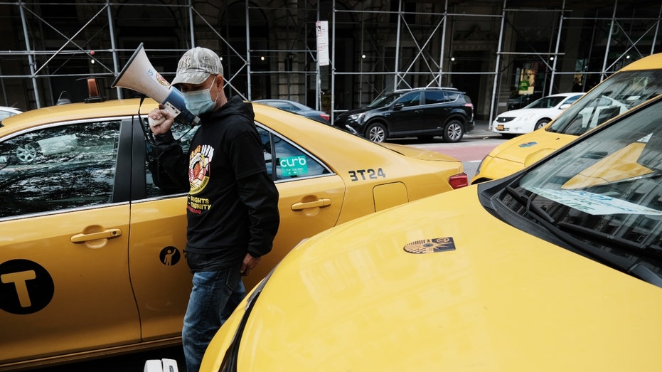 New York City taxi drivers protest over debt
