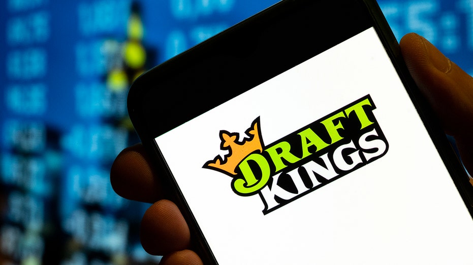 DraftKings logo on phone screen