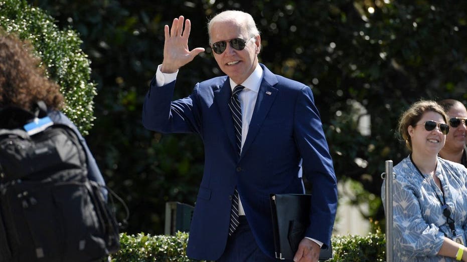 US President Joe Biden greets guests