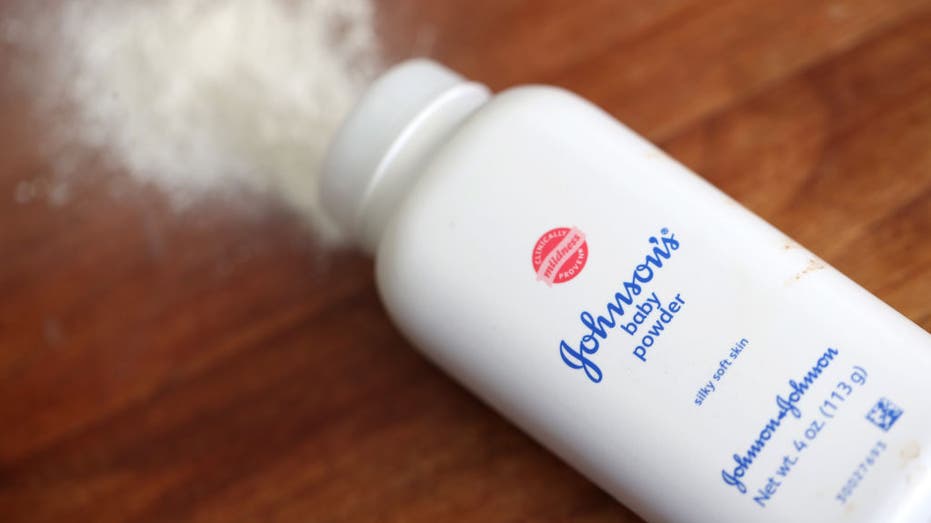Johnson's baby powder with powder emerging from the bottle