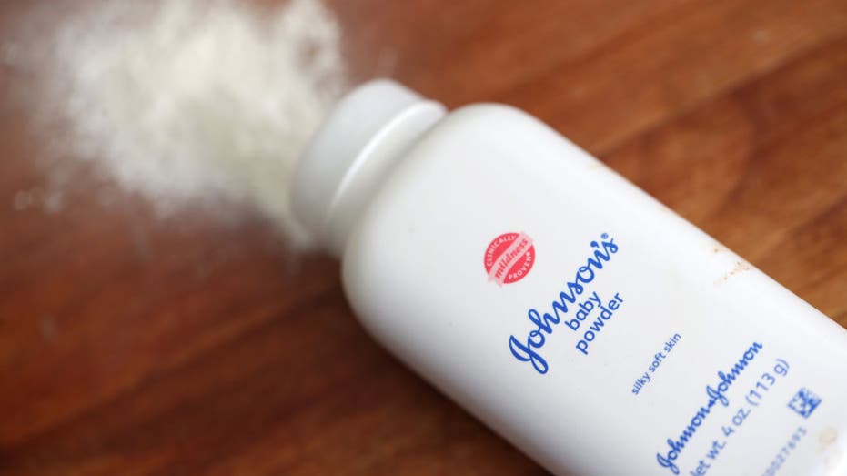 Johnson's baby powder with powder emerging from the bottle