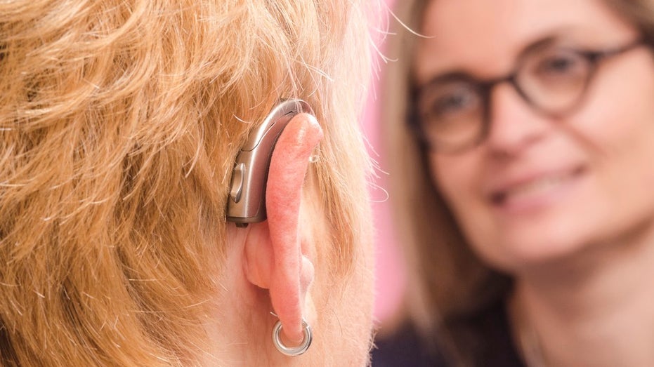 Woman wearing a hearing aid