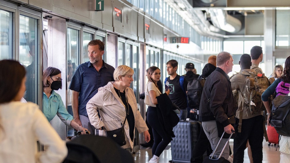 Passengers handling flight cancellations at Newark Airport