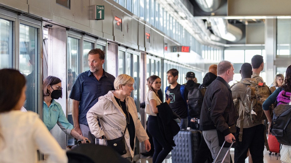 Passengers dealing with flight cancellations atNewark Airport