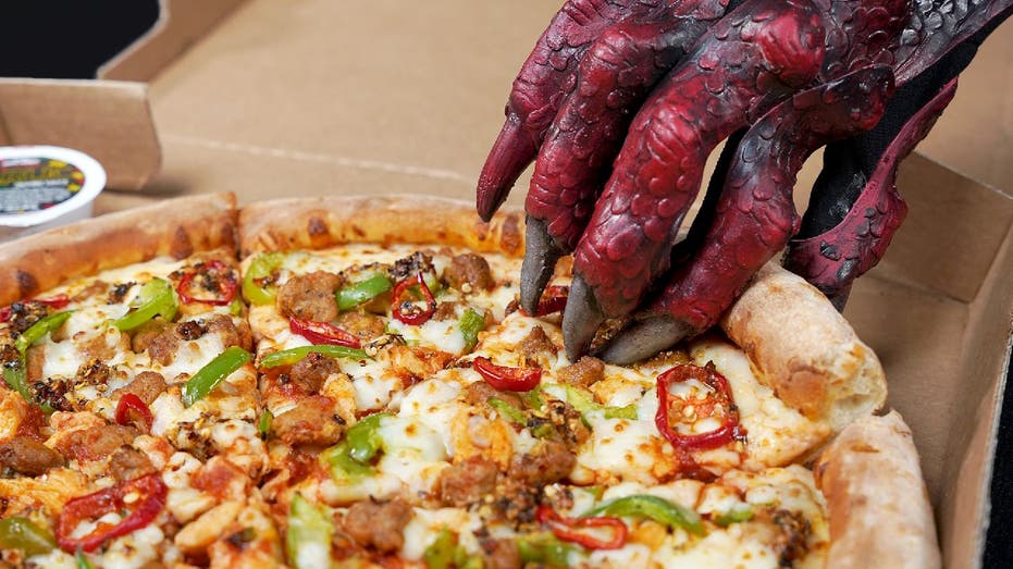 Papa John's Dragon Flame Pizza with dragon hand