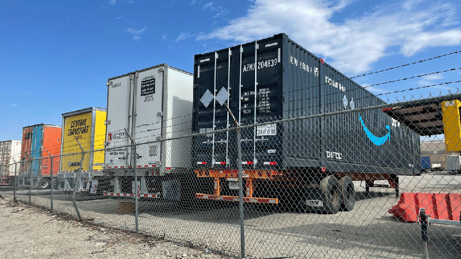 Amazon trucks in a warehouse