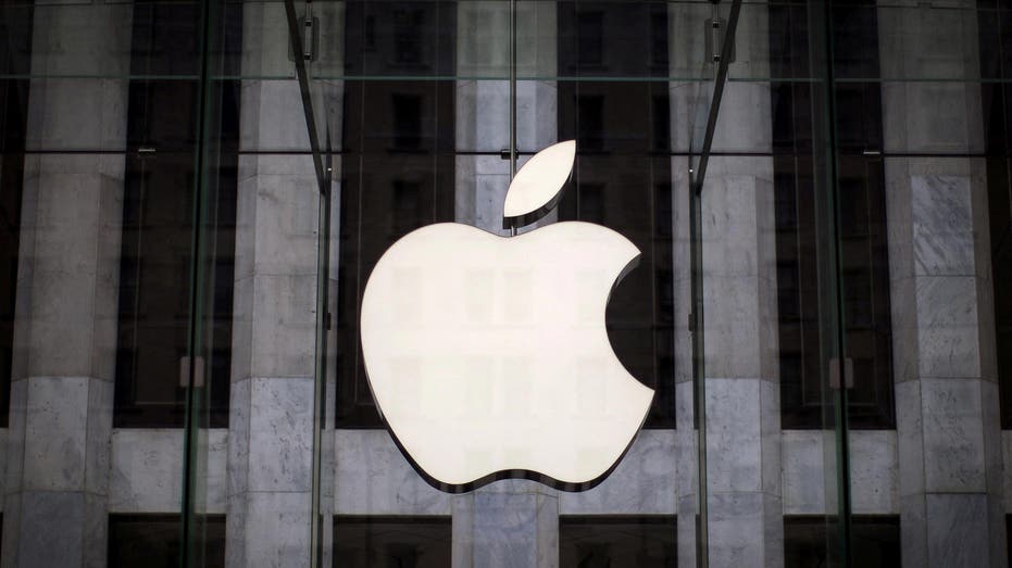 Apple logo hangs over 5th avenue store entrance