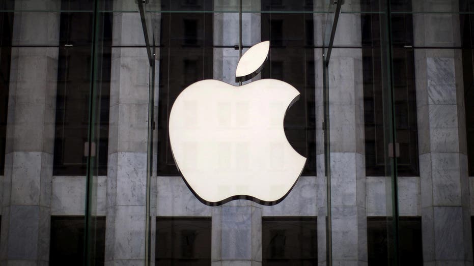 Apple logo hangs over 5th avenue store entrance