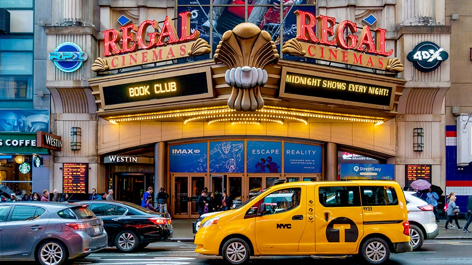 People visit the Regal Cinema theater in New York City