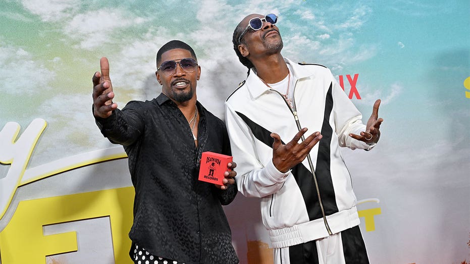 Snoop Dogg and Jamie Foxx at "Day Shift" premiere
