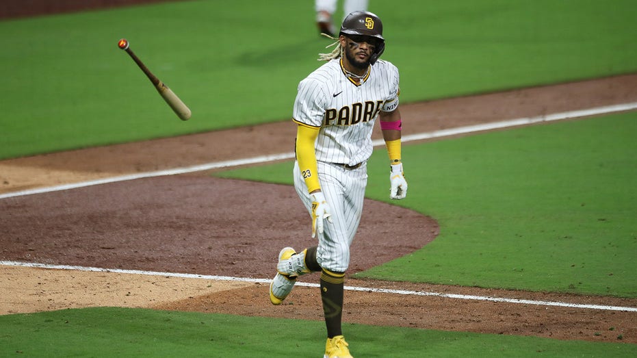 Fernando Tatis flips bat